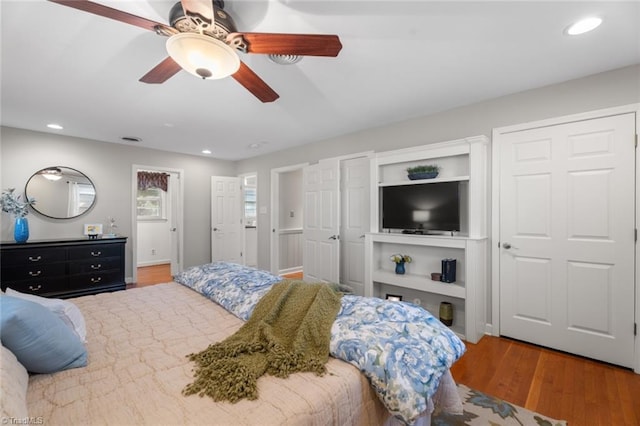 bedroom with hardwood / wood-style flooring and ceiling fan