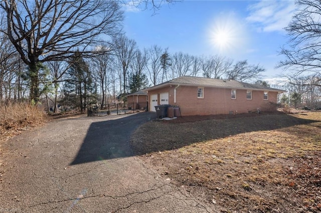 view of side of property featuring a garage