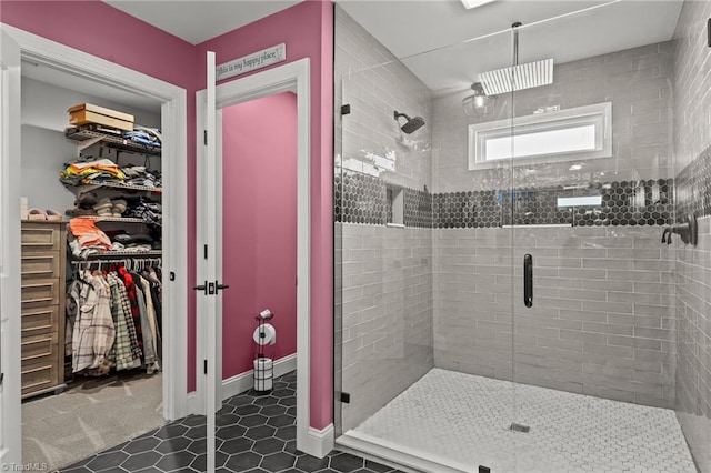 bathroom featuring an enclosed shower and tile patterned floors