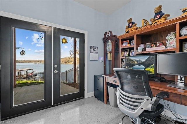 office area with french doors and a water view