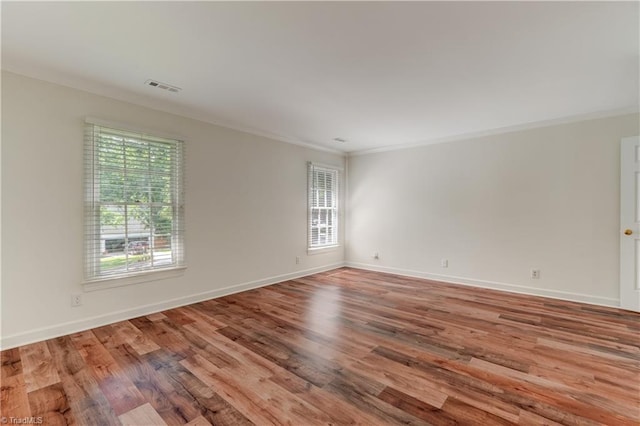 1807 Millhouse Ct, Greensboro, NC 27407 - spare room with plenty of natural light, wood finished floors, and crown molding