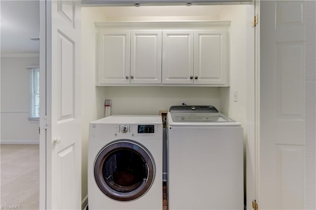 1807 Millhouse Ct, Greensboro, NC 27407 - laundry room featuring cabinet space, washing machine and dryer, crown molding, and light colored carpet