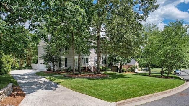 1807 Millhouse Ct, Greensboro, NC 27407 - view of front of property featuring a front lawn, a garage, and driveway