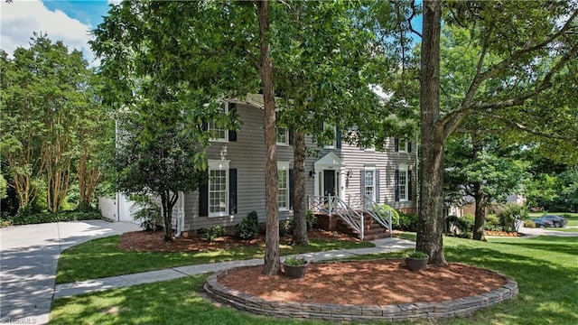 1807 Millhouse Ct, Greensboro, NC 27407 - colonial home featuring concrete driveway and a front lawn