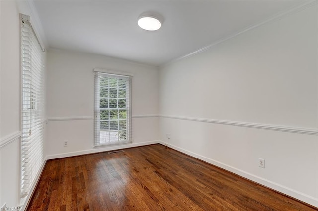 1807 Millhouse Ct, Greensboro, NC 27407 - empty room with wood finished floors and crown molding