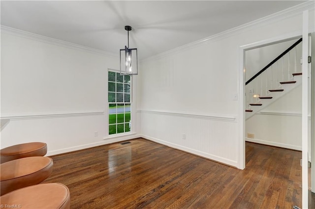 1807 Millhouse Ct, Greensboro, NC 27407 - unfurnished dining area with wood finished floors, crown molding, and stairs