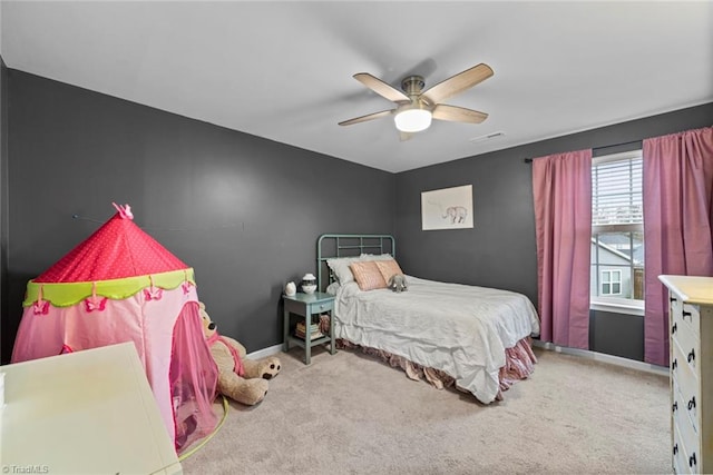 carpeted bedroom featuring ceiling fan