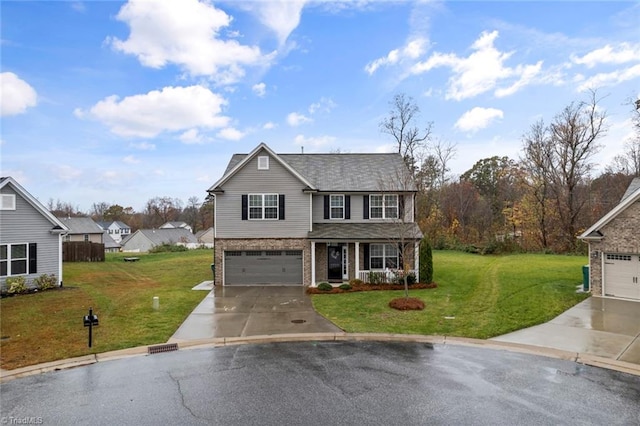 view of front of property featuring a garage and a front lawn