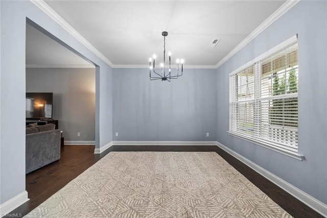 dining space featuring a chandelier, dark hardwood / wood-style floors, and ornamental molding