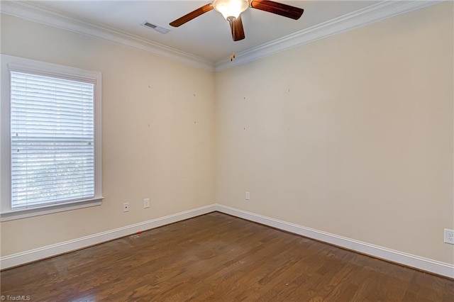 unfurnished room featuring dark wood-style flooring, a ceiling fan, visible vents, baseboards, and ornamental molding