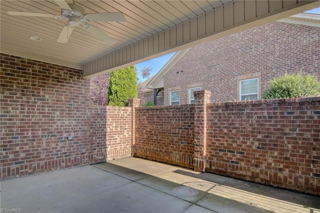 view of patio featuring a fenced backyard and a ceiling fan