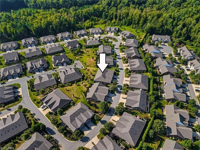 birds eye view of property with a residential view