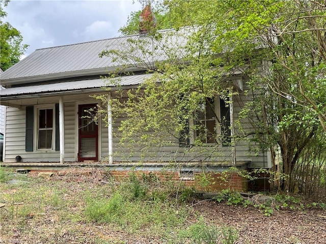 view of front of property with metal roof and a porch