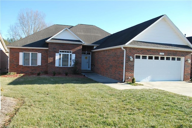 view of front of property featuring a garage and a front yard