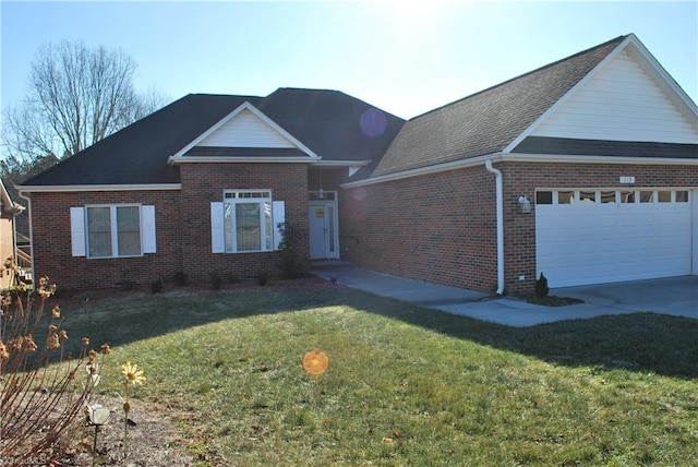 view of front of property with a garage and a front lawn