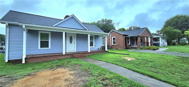 view of front of property with a porch and a front lawn