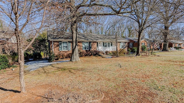 ranch-style house with a front lawn