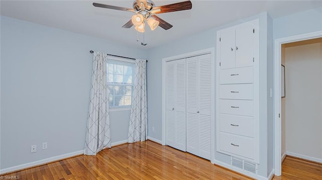 unfurnished bedroom featuring ceiling fan and light hardwood / wood-style floors