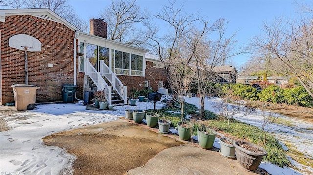 back of house with a sunroom