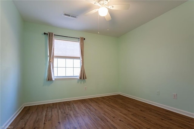 empty room with hardwood / wood-style flooring and ceiling fan