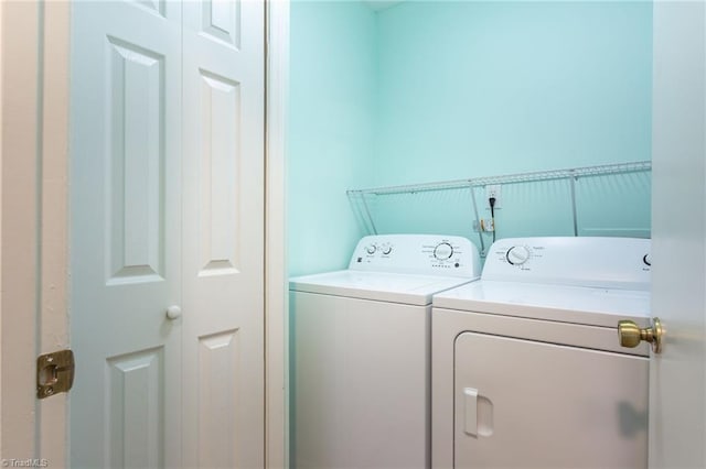 laundry area with independent washer and dryer