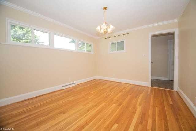 7040 Franklin Rd, Lewisville, NC 27023 - unfurnished room with light wood-type flooring, a chandelier, and crown molding