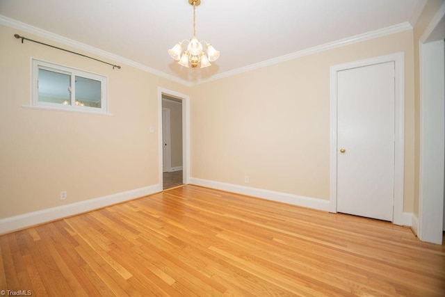 7040 Franklin Rd, Lewisville, NC 27023 - spare room with a chandelier, crown molding, and light wood-style floors