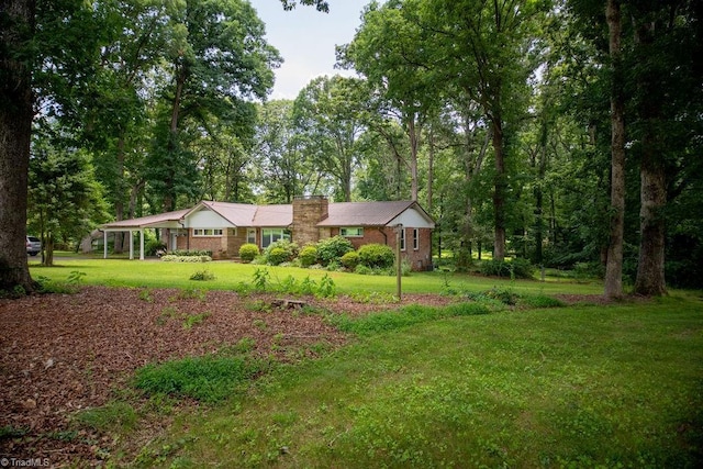 7040 Franklin Rd, Lewisville, NC 27023 - view of front of house with a front yard and a chimney