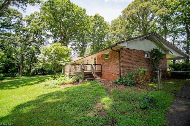 7040 Franklin Rd, Lewisville, NC 27023 - view of home's exterior featuring brick siding and a deck