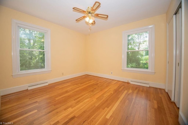 7040 Franklin Rd, Lewisville, NC 27023 - spare room with light wood finished floors, plenty of natural light, and a ceiling fan