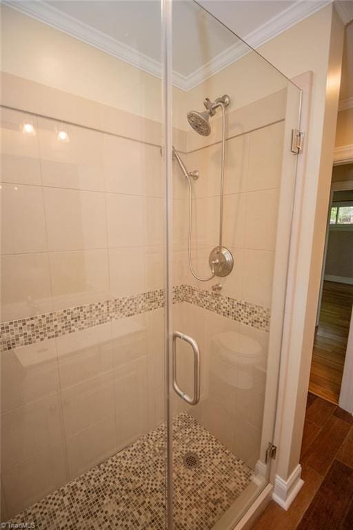 7040 Franklin Rd, Lewisville, NC 27023 - full bath with crown molding, a shower stall, and wood finished floors