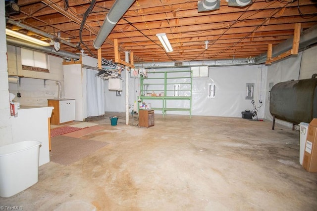 7040 Franklin Rd, Lewisville, NC 27023 - unfinished below grade area featuring oil tank