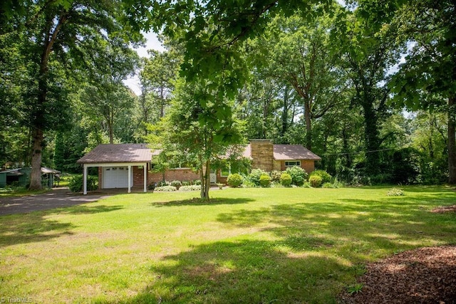 7040 Franklin Rd, Lewisville, NC 27023 - view of green lawn with asphalt driveway