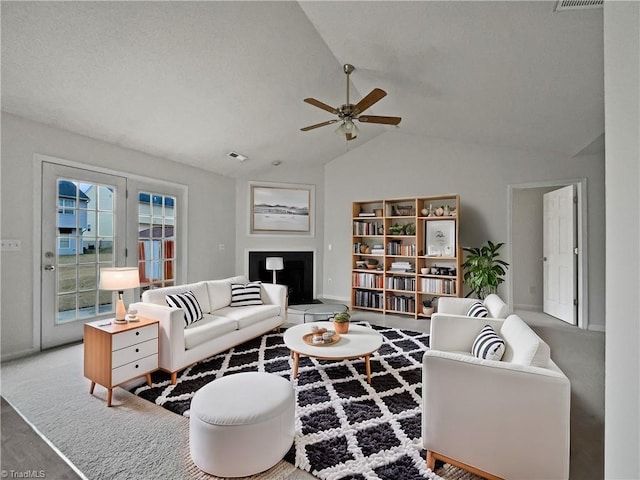 living room featuring lofted ceiling and ceiling fan