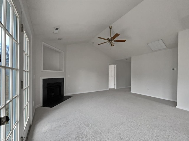 unfurnished living room featuring lofted ceiling, ceiling fan, and carpet