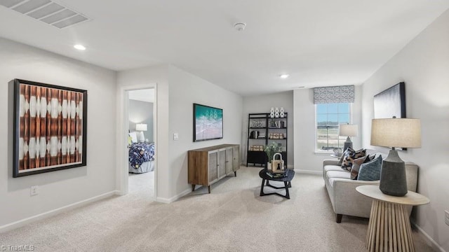 living area with light colored carpet, visible vents, recessed lighting, and baseboards