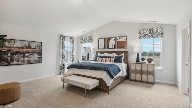 bedroom with carpet flooring, baseboards, vaulted ceiling, and visible vents