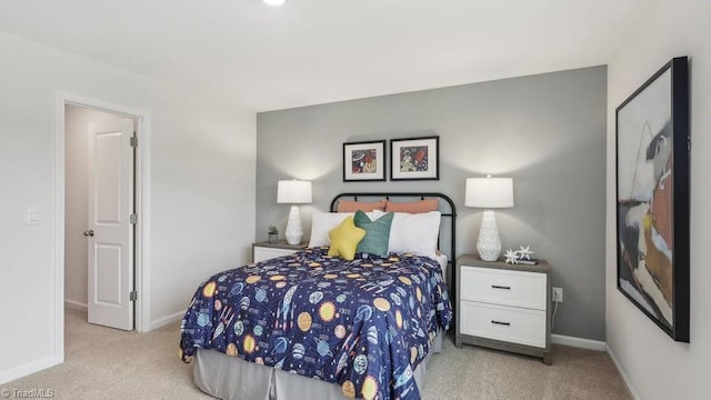 bedroom with baseboards and carpet floors