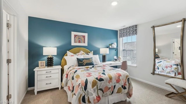 carpeted bedroom featuring baseboards