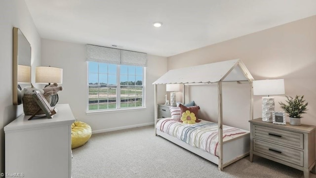 bedroom with carpet flooring and baseboards