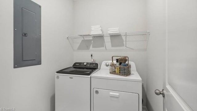 laundry area with separate washer and dryer, laundry area, and electric panel