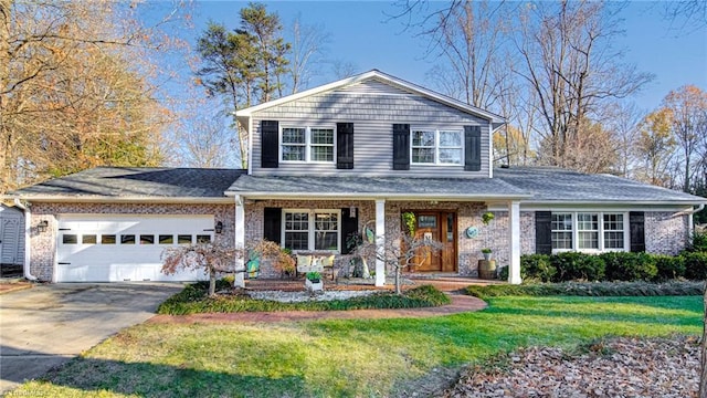 view of property featuring a garage and a front lawn