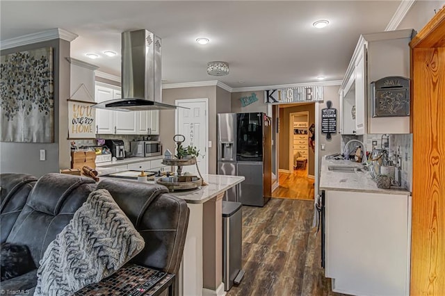 kitchen with island exhaust hood, appliances with stainless steel finishes, dark hardwood / wood-style flooring, a breakfast bar, and white cabinets