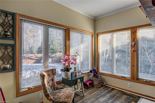 living area featuring ornamental molding and dark wood-type flooring