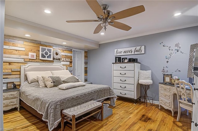 bedroom with ceiling fan, light wood-type flooring, and crown molding