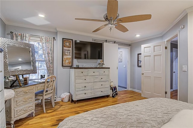 bedroom with hardwood / wood-style floors, ceiling fan, and crown molding