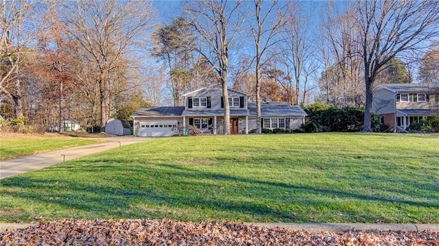 view of front of home with a garage and a front lawn