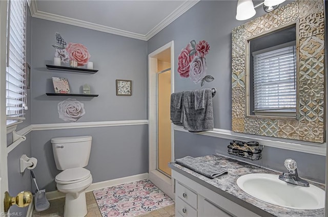 bathroom with vanity, toilet, ornamental molding, and walk in shower