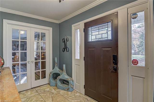 entrance foyer featuring a wealth of natural light, french doors, and crown molding