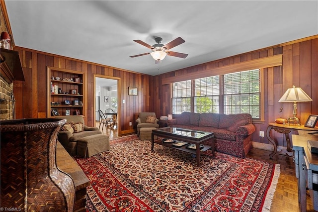 1732 Edgewood Ave, Burlington, NC 27215 - living room with wood walls, a ceiling fan, and built in features